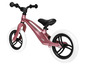 Een roze Lionelo loopfiets met witte banden.