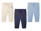 Drie babybroekjes in beige, blauw en donkerblauw.