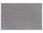 Een grijs badmatje met een zachte, textuur.