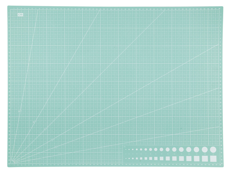 Een groene snijmat met centimeterschaal.