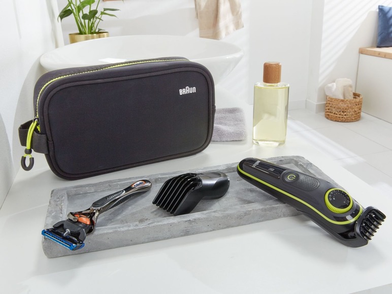 Een Braun scheerapparaat, een Gillette scheermesje en een toilettas.
