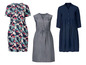 Drie jurken: één met bloemenprint, één donkerblauw en één grijs.