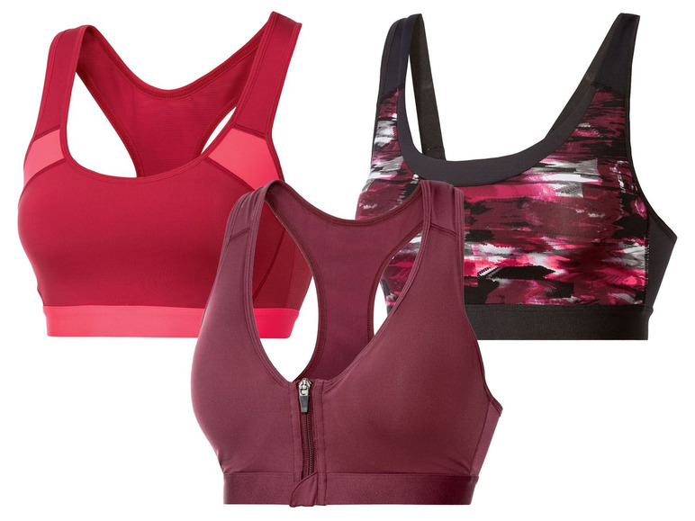 Drie sportbeha's in verschillende kleuren en stijlen.
