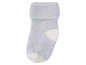 Grijze sok met witte hiel en teen