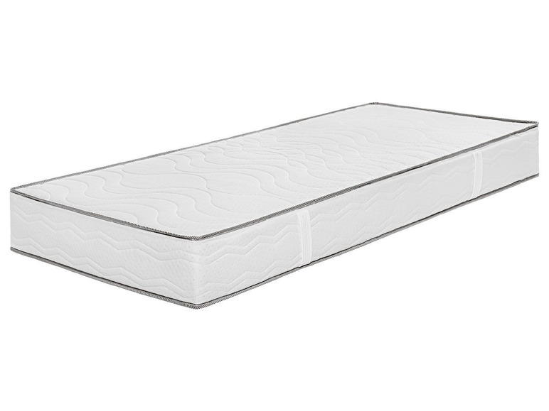 Een wit matras met een golvende structuur.