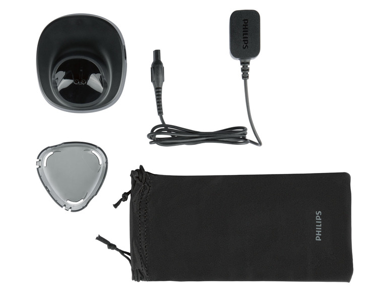 Een Philips scheerapparaat oplader, scheerkop en opbergtasje.