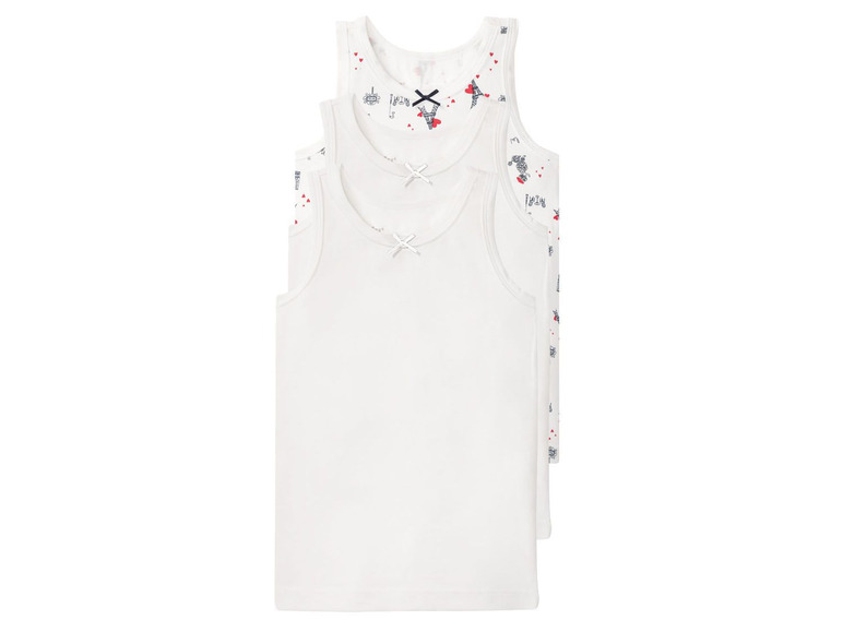Drie witte tanktops voor meisjes met een print van hartjes en torens.