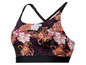 Een zwarte sportbeha met bloemenprint.
