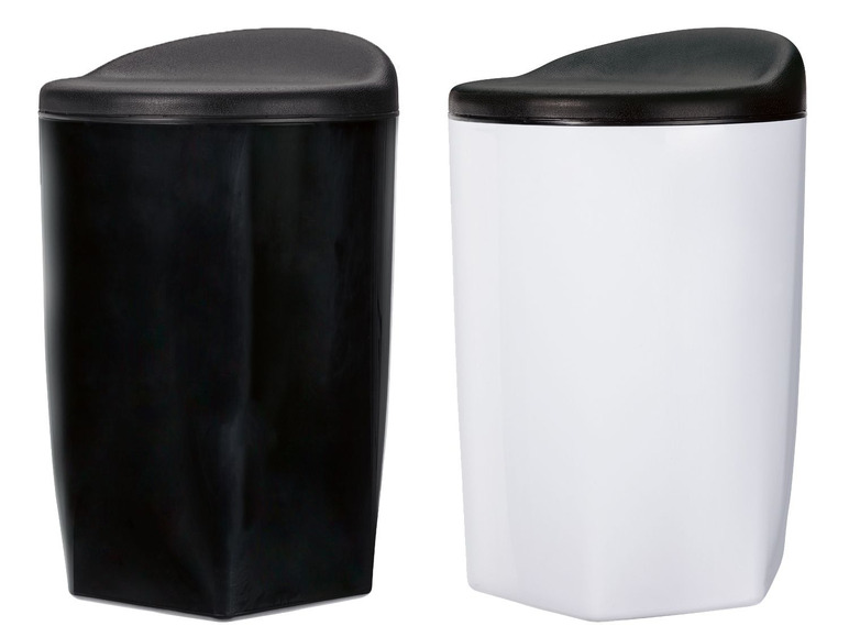 Twee ronde opbergbakken, een zwart en een wit.