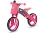 Een roze Kinderkraft loopfiets met een sterrenthema.