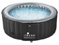Een opblaasbaar jacuzzi met grijs randje en blauw water.