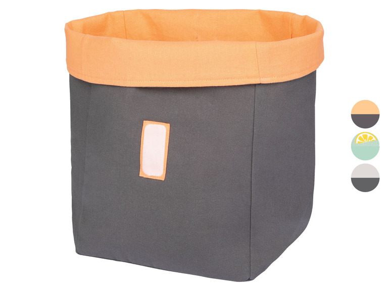 Grijze opbergmand met oranje rand.