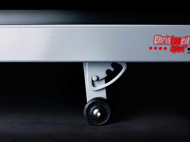 Een zilveren loopband met een wiel, merk Christophert Sport.