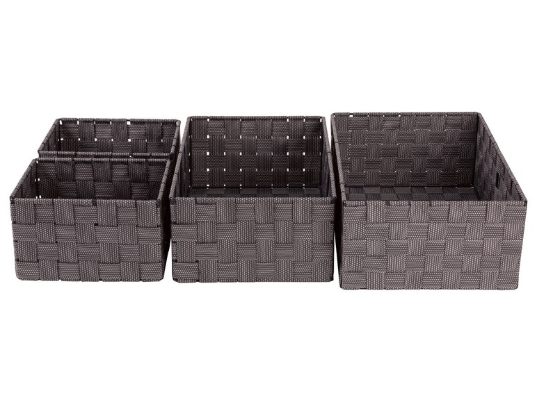 Vier grijze opbergmanden met een geweven ontwerp.