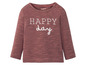 Een roze longsleeve met 'Happy day' print van Lupilu.