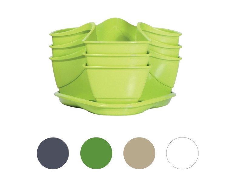 Een stapel groene potten en schotels voor planten.