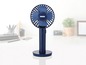 Blauwe Unold tafelventilator met draaibare kop.