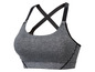 Een grijze sportbeha met gekruiste bandjes.
