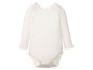 Witte baby romper met lange mouwen.