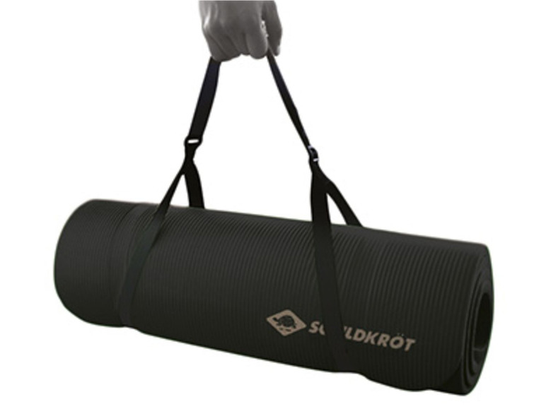 Een opgerolde zwarte yogamat met een draagriem van het merk 'Schildkröt'.