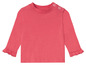 Een roze longsleeve met ruches voor baby's.