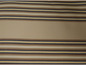 Beige stof met horizontale strepen in bruin, zwart en geel.