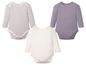 Drie baby rompers met lange mouwen: gestreept, effen wit en effen paars.