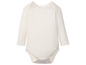 Witte baby romper met lange mouwen.