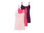 Drie effen tanktops in roze, roze en paars.