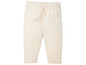 Beige babybroek met een olifant-print.
