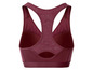 Een donkerrode sportbeha met mesh panelen.