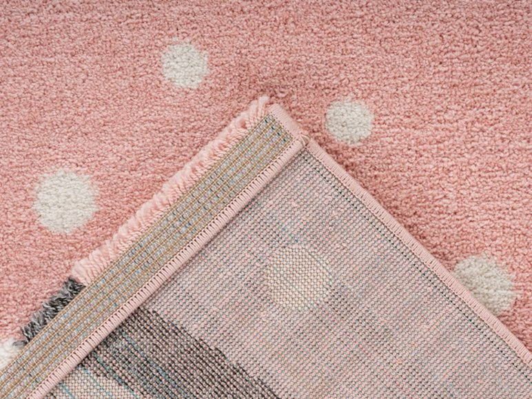 Roze vloerkleed met witte stippen