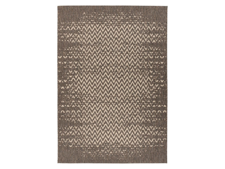 Beige en donkerbruin geweven tapijt met zigzagmotief.