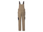 Beige overall met zwarte schouderbanden.
