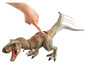 Een Jurassic World T-Rex dinosaurus speelgoedfiguur met bewegende staart.