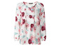 Witte blouse met lange mouwen en bloemenprint.