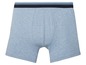 Blauwe boxershorts met een blauwe en zwarte tailleband.
