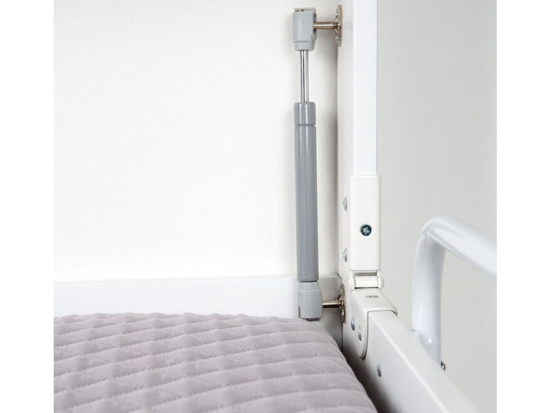 Een witte bedbank met een gasveer en een matras.