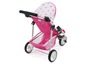 Een roze kinderwagen met een sterrenprint voor poppen.