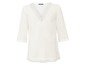 Witte blouse met v-hals en kantdetails.