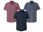 Drie korte mouw overhemden: rood-wit geruit, blauw-wit geruit en effen donkerblauw.