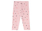 Roze leggings met zwarte en rode sterren.