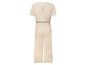 Beige jumpsuit met korte mouwen.