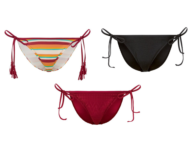 Drie bikini onderdelen: gestreept, effen zwart en effen rood.
