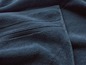 Twee blauwe badhanddoeken gevouwen.
