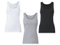 Drie effen tanktops in wit, grijs en zwart.
