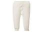 Witte gebreide broek voor baby's.