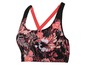 Sportbeha met bloemenprint en rode schouderbandjes.
