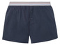 Donkerblauwe boxershorts met knopen en een gestreepte tailleband.
