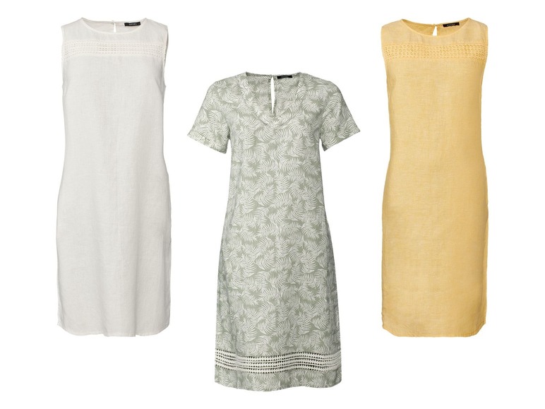 Drie linnen jurken, één wit, één met een bladerenprint en één geel.